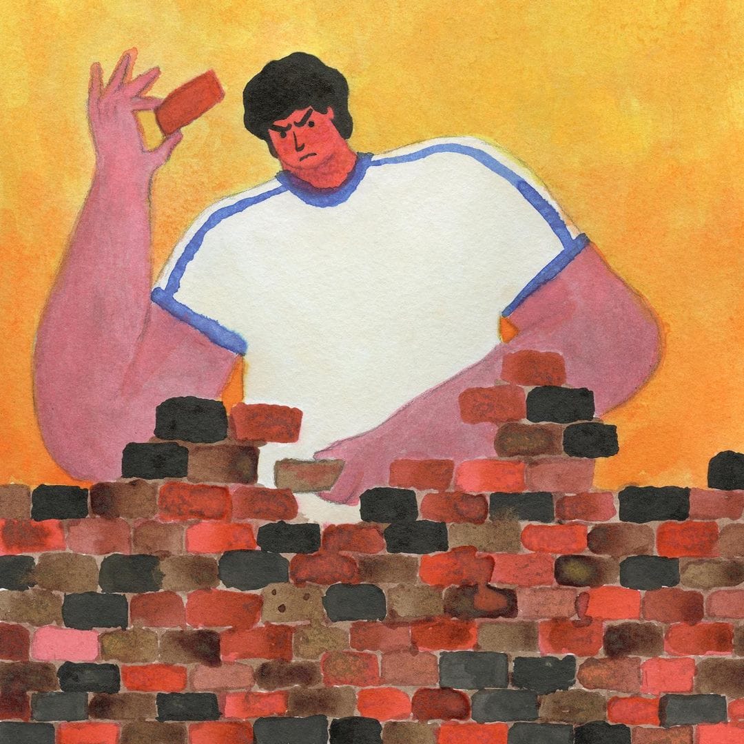 Lukasz Drzyvimski, man building a wall